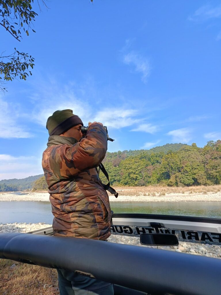 Wildlife photographer beside the Ramganga during a Safari Lab Corbett journey