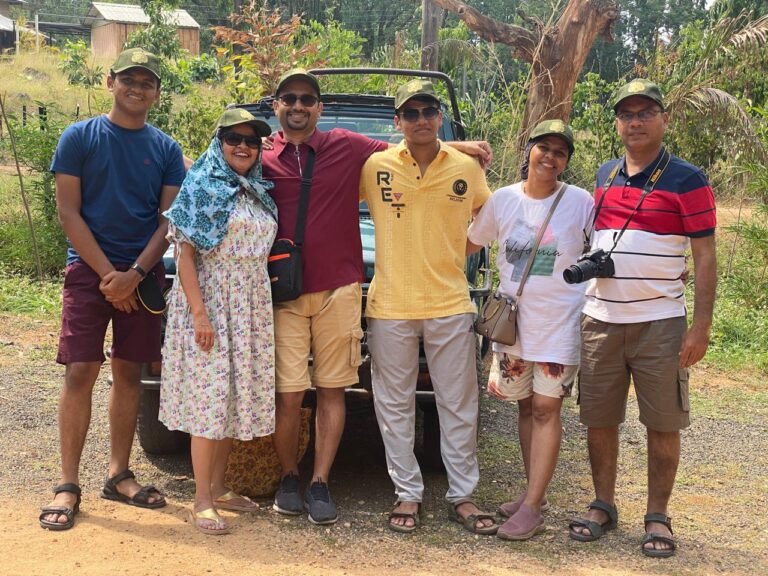 Safari Lab guests together beside their safari vehicle in Pench