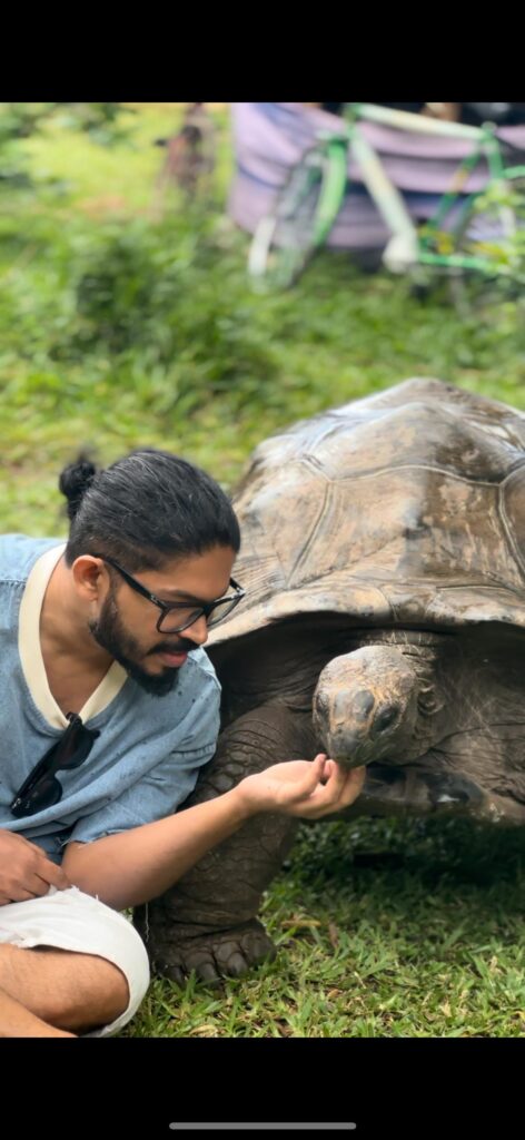Safari Lab guest visiting giant tortoises in Zanzibar